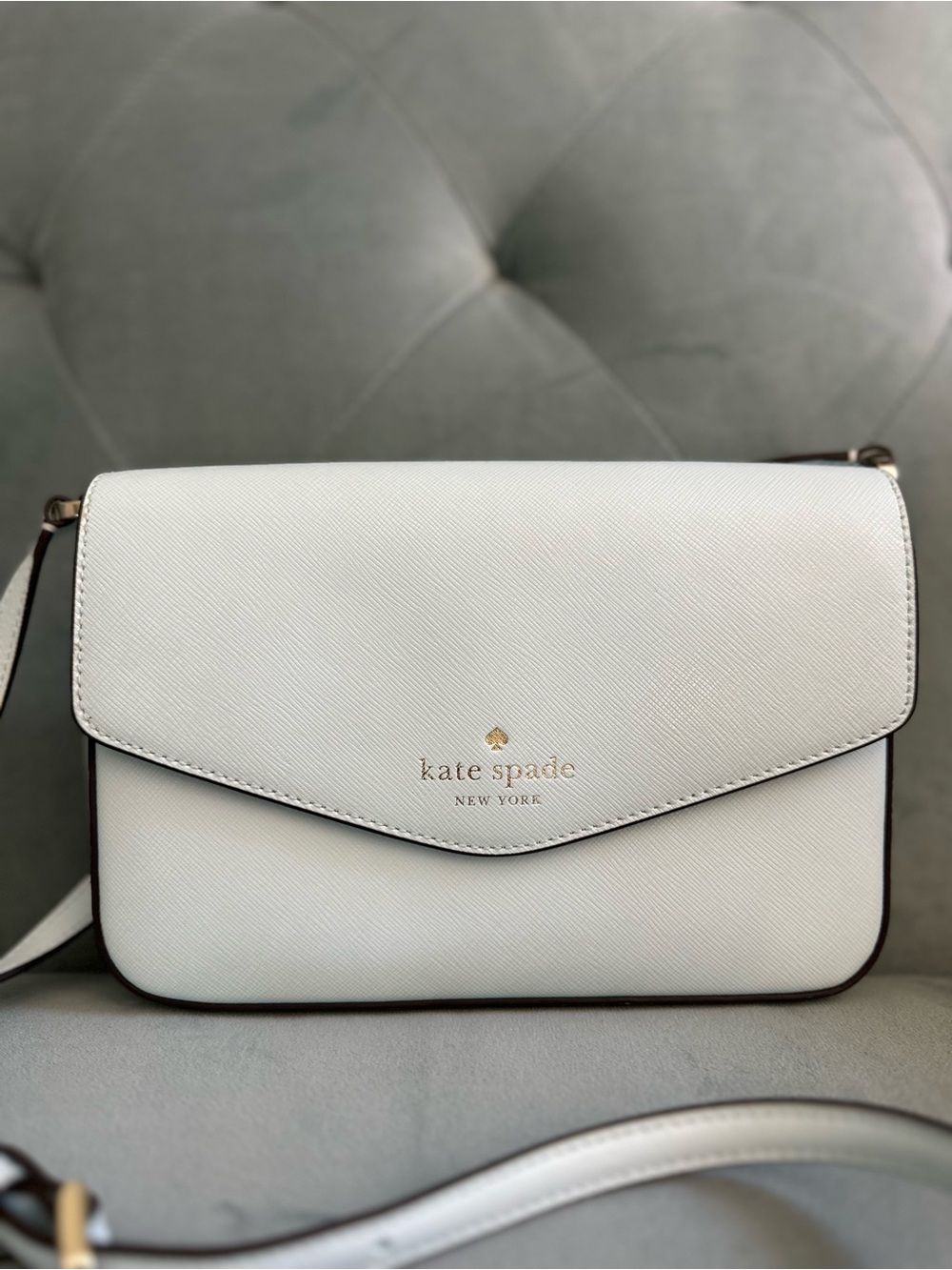 kate spade baby blue saffiano crossbody bag with gold logo
